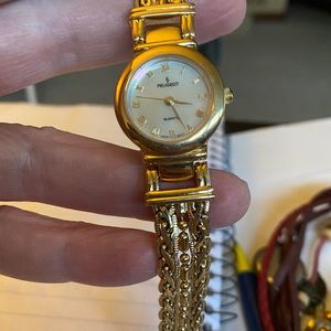Women’s gold bracelet Peugeot watch